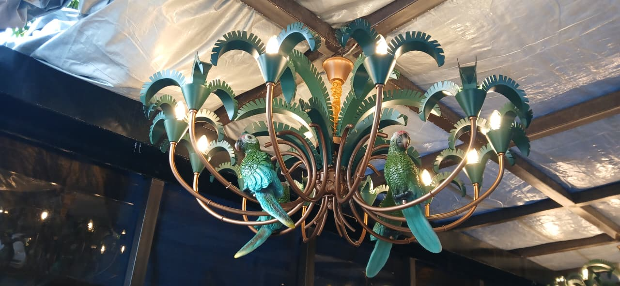 Italian-inspired parrot chandelier with handcrafted artistic elements installed by professional chandelier experts.